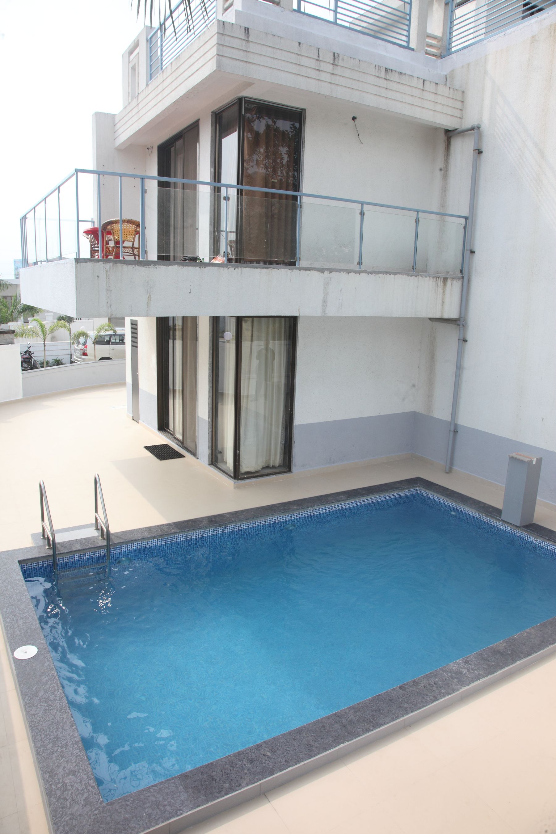 Private pool beside a villa at Sun Palms, Lonavala