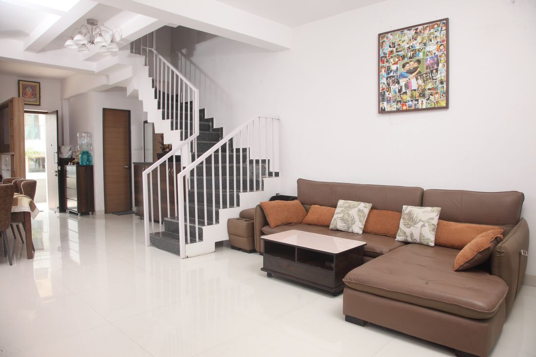 Living room with sectional sofa and staircase