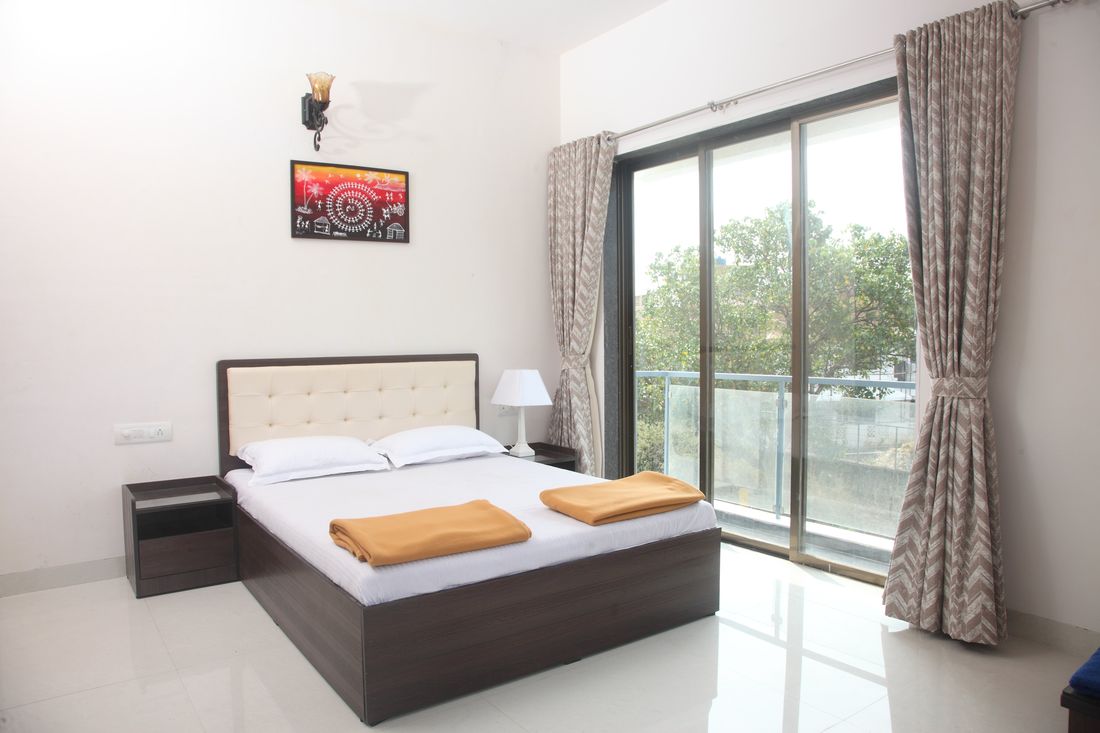 Bedroom with sliding doors to a balcony